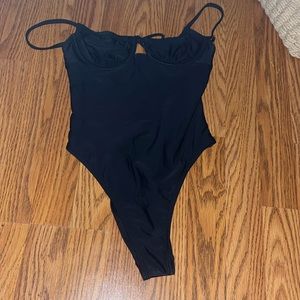 Black one peice kind of cheeky
